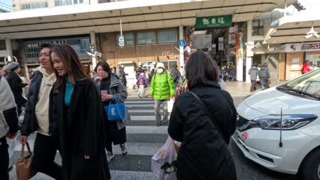 pedestrians crossing busy urban intersection