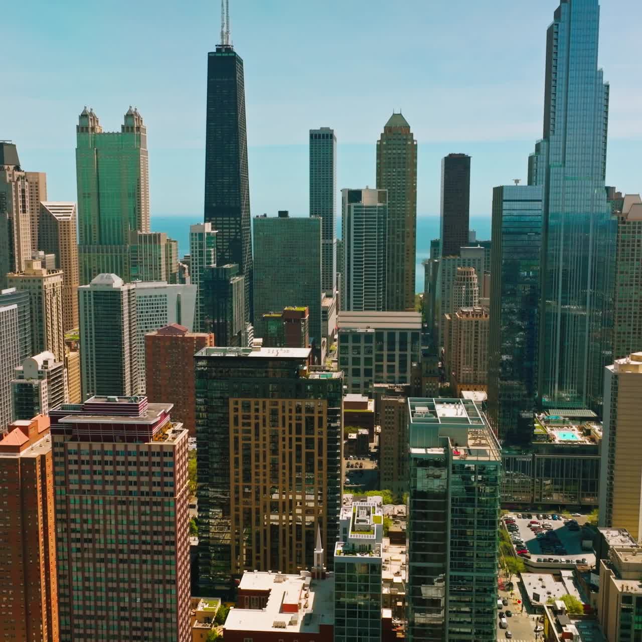 Wonderful and diverse buildings of Chicago, Illinois. Drone footage flying over the city at the backdrop of skyscrapers