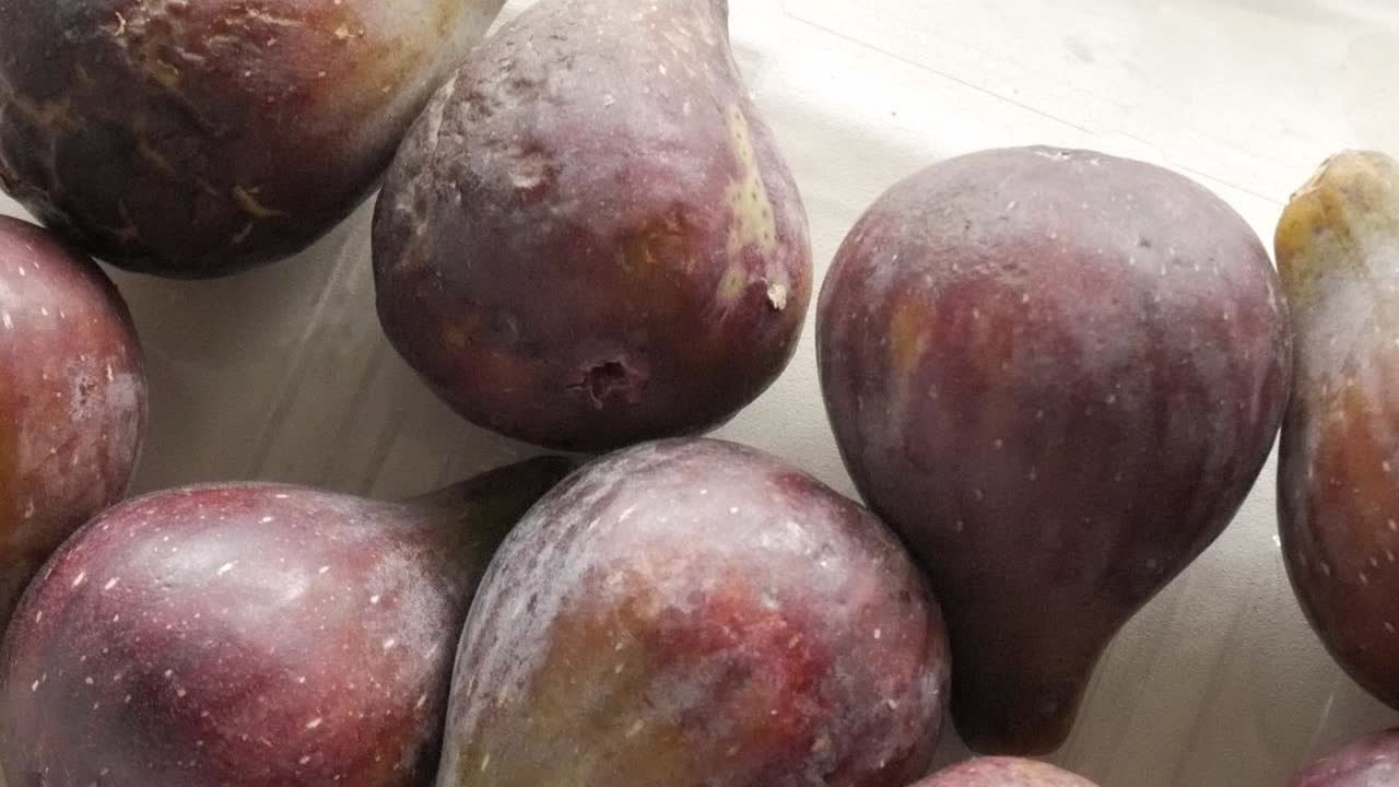 Fresh figs close-up, showing their rich purple color and smooth texture