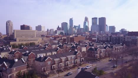 a beautiful aerial flying over suburban houses towards minneapolis minnesota