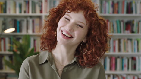 portrait of pretty young librarian woman standing in library attractive student smiling close up laughing