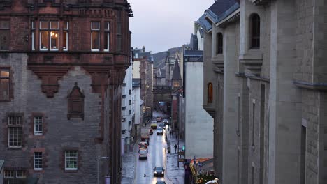 narrow street in edinburgh with old buildings