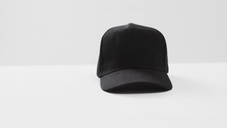 Video-of-black-baseball-cap-and-copy-space-on-white-background
