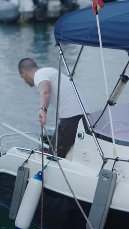 man on a boat in the marina