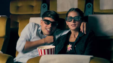 man and woman in the cinema watching a 3d movie