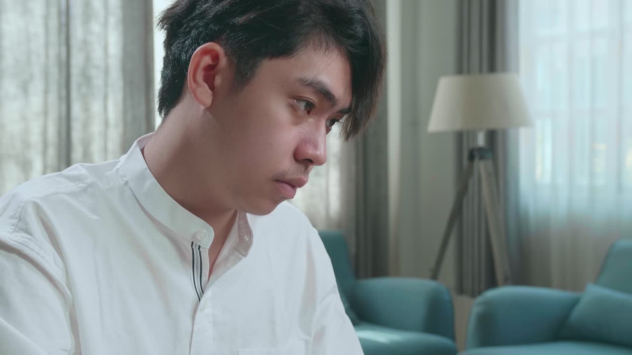 Close Up Of Asian Man Student Using Computer To Study Online At Home