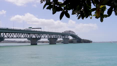 Auckland's-harbour-bridge-into-the-ocean-on-sunny-day