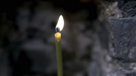 candle light on a brick wall