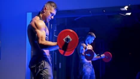 young brutal sexy strong bodybuilder athletic fitness man pumping up barbell. abs muscles workout bodybuilding concept background. blue light filter.