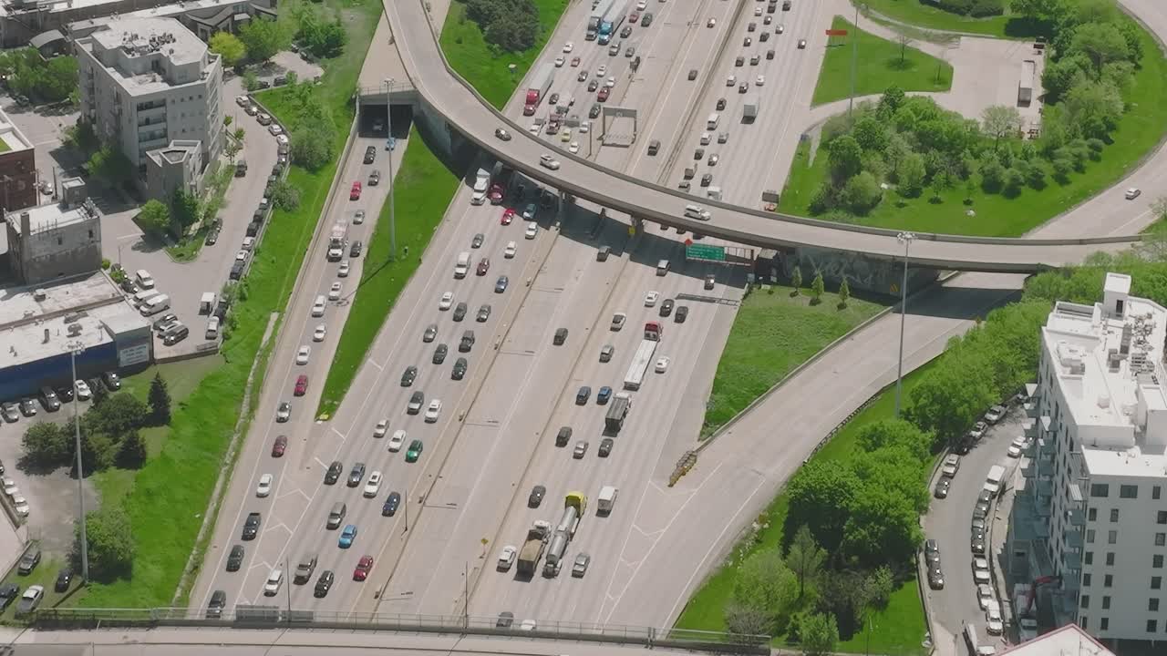 Aerial view of traffic flow in Chicago with green parks nearby