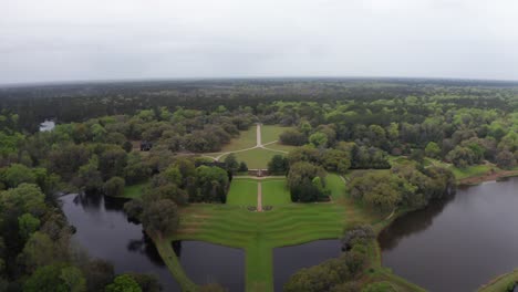 aerial wide reverse pullback shot of historic middleton place plantation along the ashley river in low country south carolina