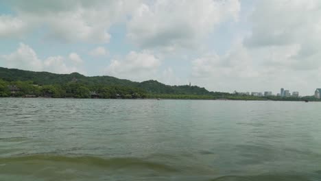 view from the west lake with baochu pagoda and hangzhou city in the background china