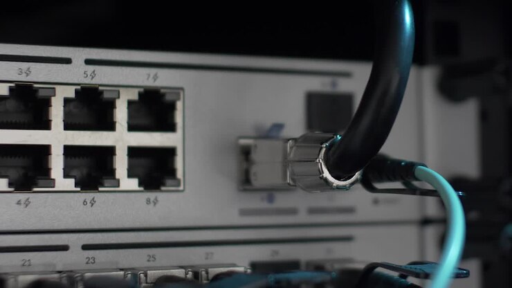 Close Up Panning Shot View Of Back Of Server Network Server Rack With Blinking LED Lights