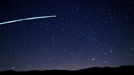 meteor shower over mountains