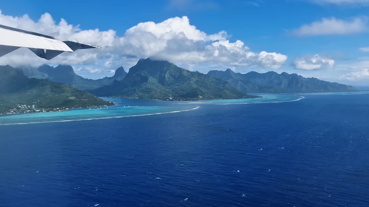 Moorea Island, French Polynesia, Airplane Passenger POV of Exotic Coast, Coral Reefs and Lagoon