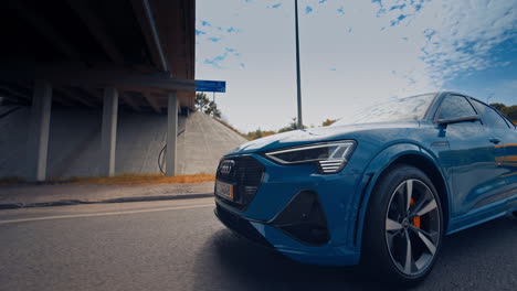 audi e tron profile view. audi e tron, a fully electric car on highway