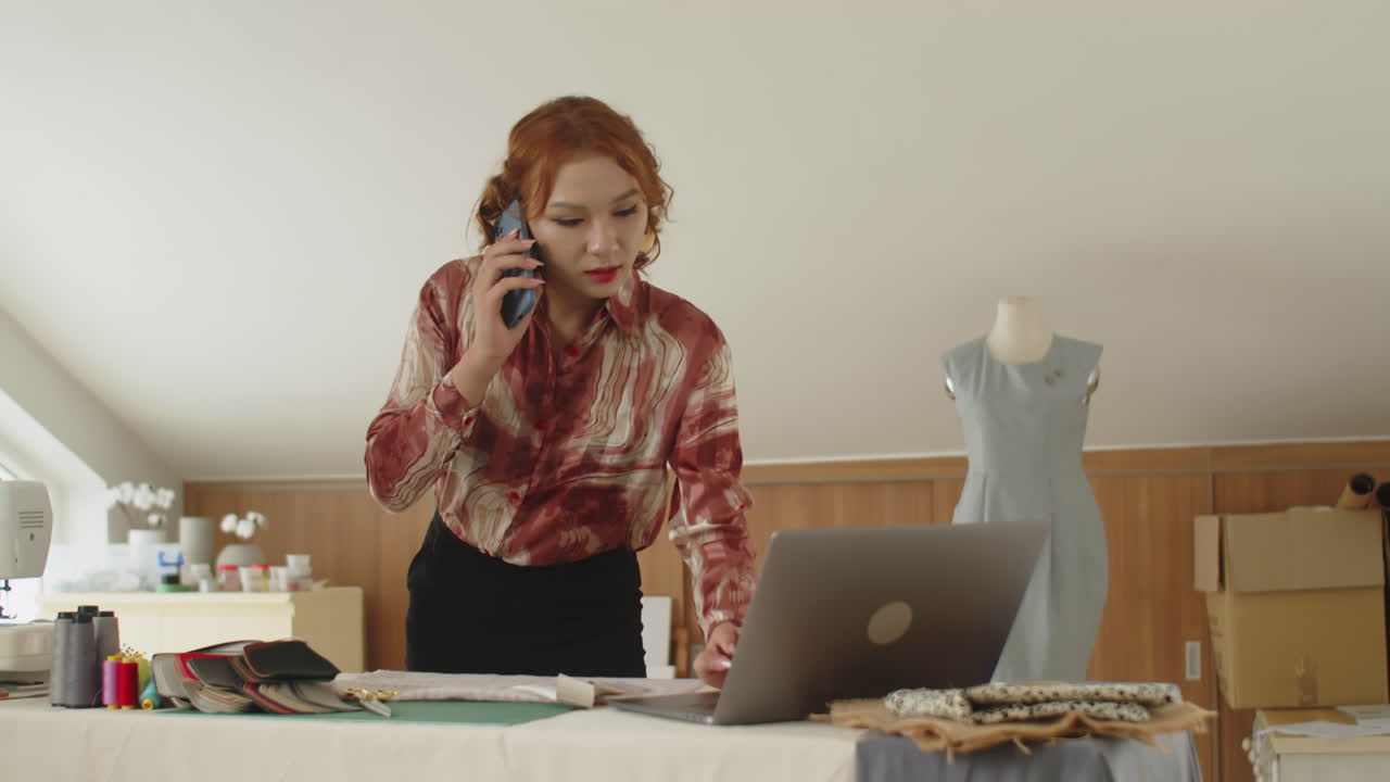 Sewing Studio Owner Talking with Client on Smartphone
