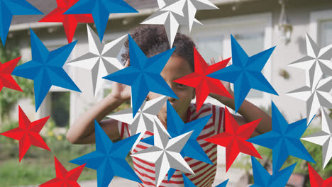 Animation-of-red,-blue-and-white-stars-over-happy-african-american-girl-having-fun