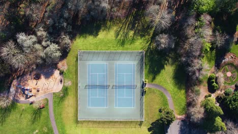 4k aerial drone shot overlooking local portland, oregon tennis court