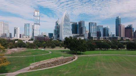 Austin,-Texas-city-skyline-on-picturesque-sunny-fall-day,-aerial-sweep-with-4k-drone-of-high-rise-buildings