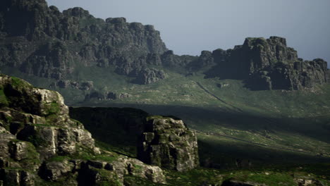 mountain landscape with rugged rocks and valleys under soft light conditions