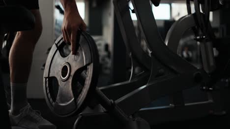 man lifting weights at the gym