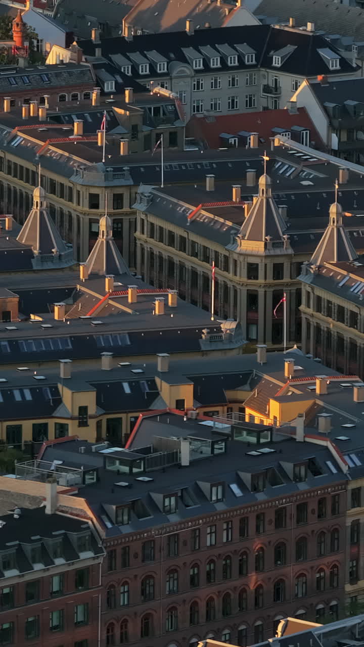Aerial drone view of Vesterbro district in Copenhagen, Denmark at sunset. Vertical