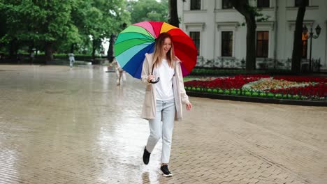 Fun-good-mood-for-rainy-weather-woman-jump-in-puddle-with-splash