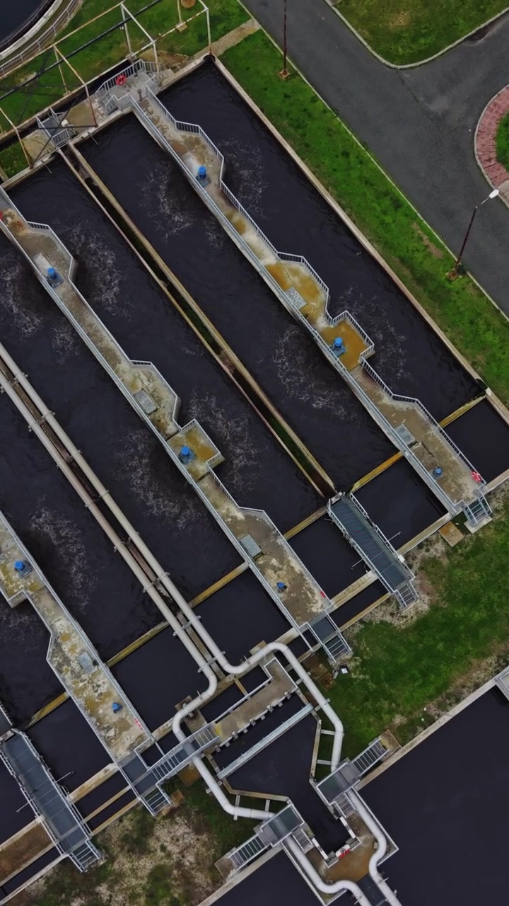 Water treatment facility showing tanks and processing areas from above
