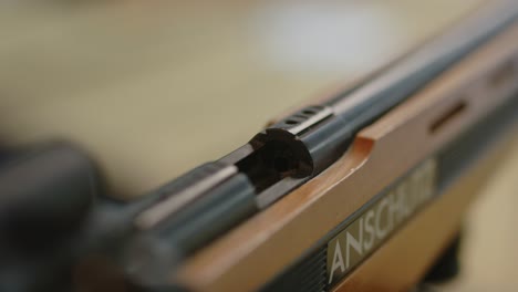 Close-up-of-hand-removing-chamber-flag-of-sporting-rifle