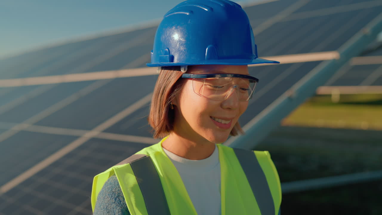 Engineers Inspecting Solar Panels at a Solar Farm