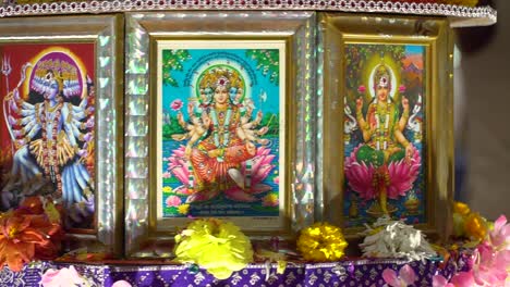 turning altar showing depictions of hindu goddesses during navratri celebrations