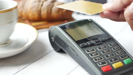 paying with credit card at a cafe