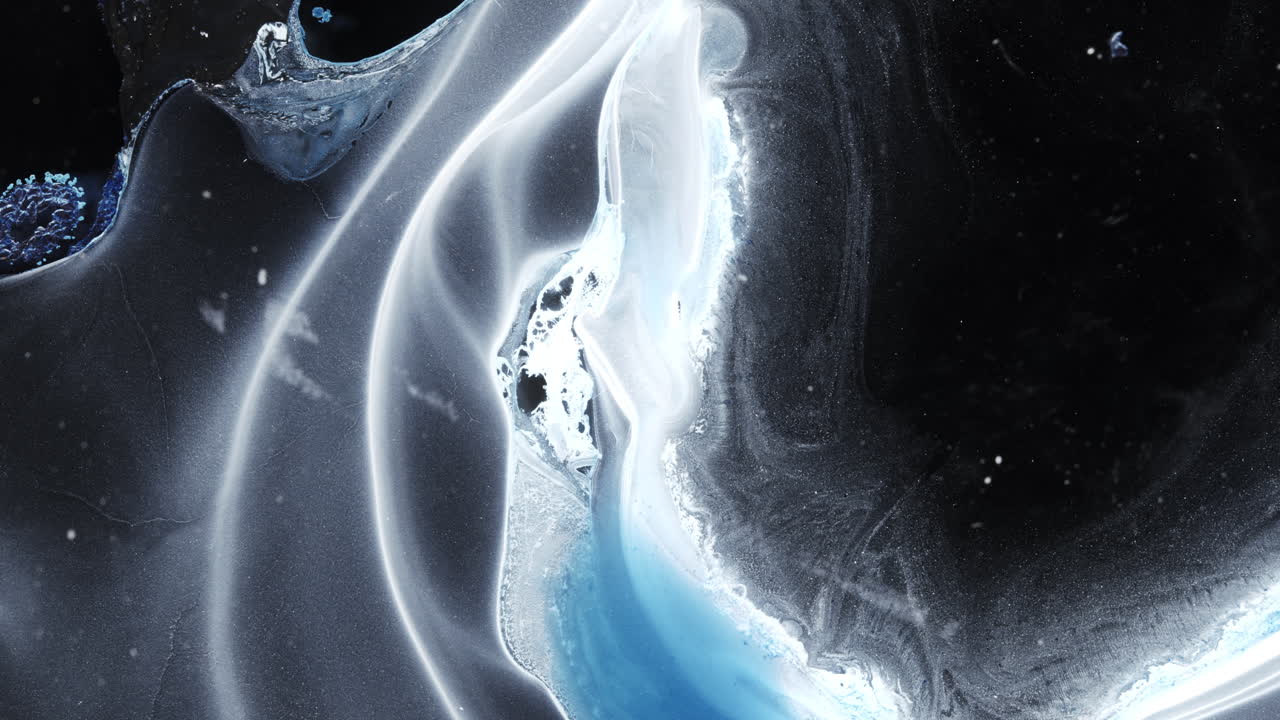 Ethereal abstract shapes in white and blue ink forming flowing macro composition