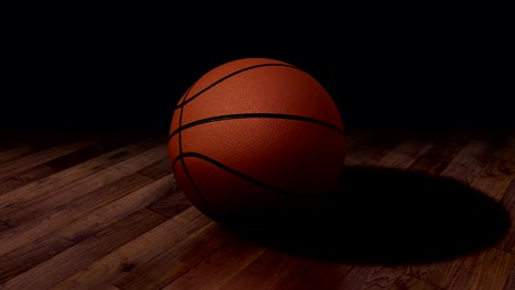 looped rotation around classic basketball ball plased on the wet asphalt