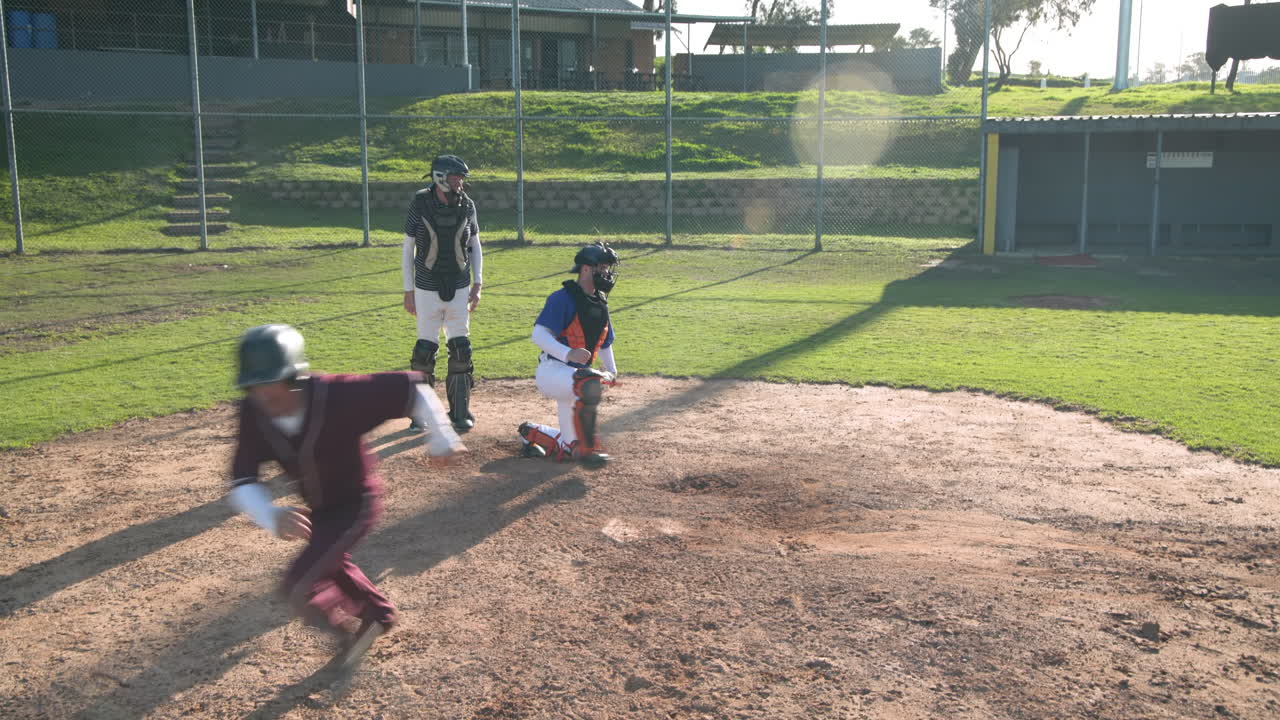 Playing baseball, batter running to first base while catcher and umpire watch