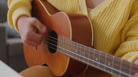 girl with down syndrome singing song with guitar