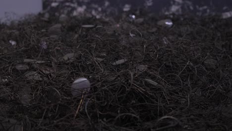 Video of Objects being Destroyed in Machine Closeups of Crushing and Breaking a Video Shows Destruction of Coins Metal and Glass in a Machine with Closeups and a Watermark Emphasis is on the Process of Crushing and Breaking Various Objects