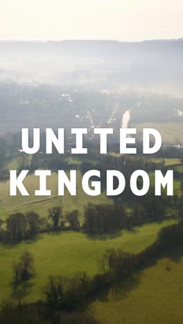 vertical video aerial drone shot of fields and countryside in uk with animated graphic spelling out united kingdom