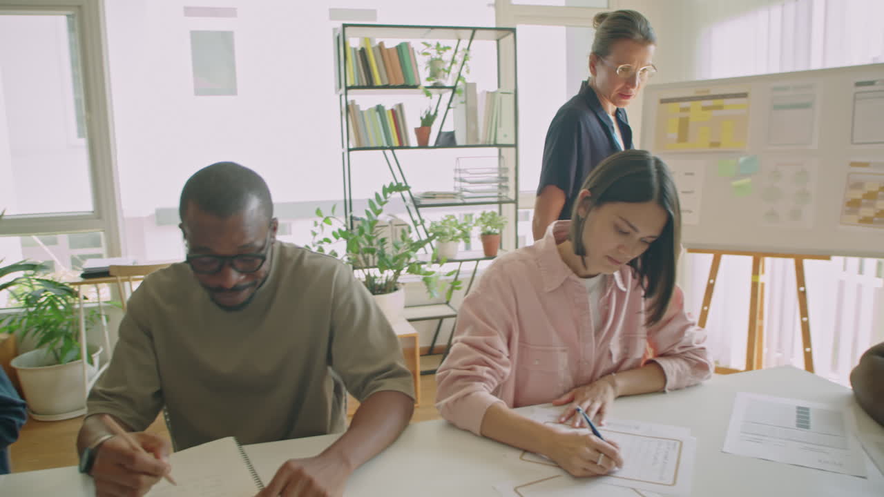 Teacher Controlling Immigrant Students Writing Test