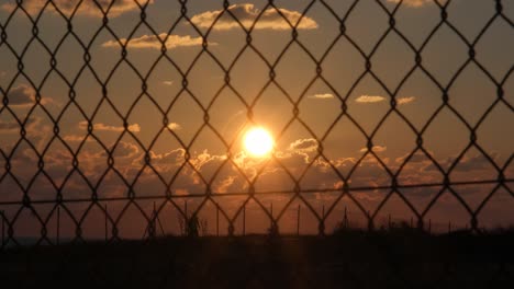 wide shot of a man running outside against a golden sunset