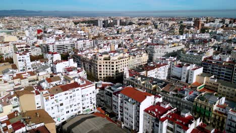 ascending shot of compact life in the centre of valencia , showcasing the many rooftops that's very common in spain