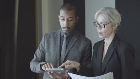 two business colleagues analyzing documents