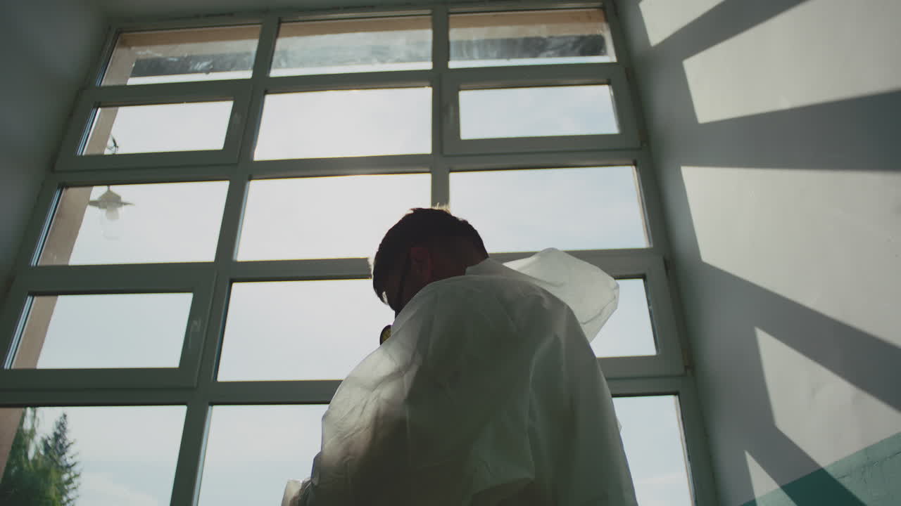 Person in Hazmat Suit with Gas Mask