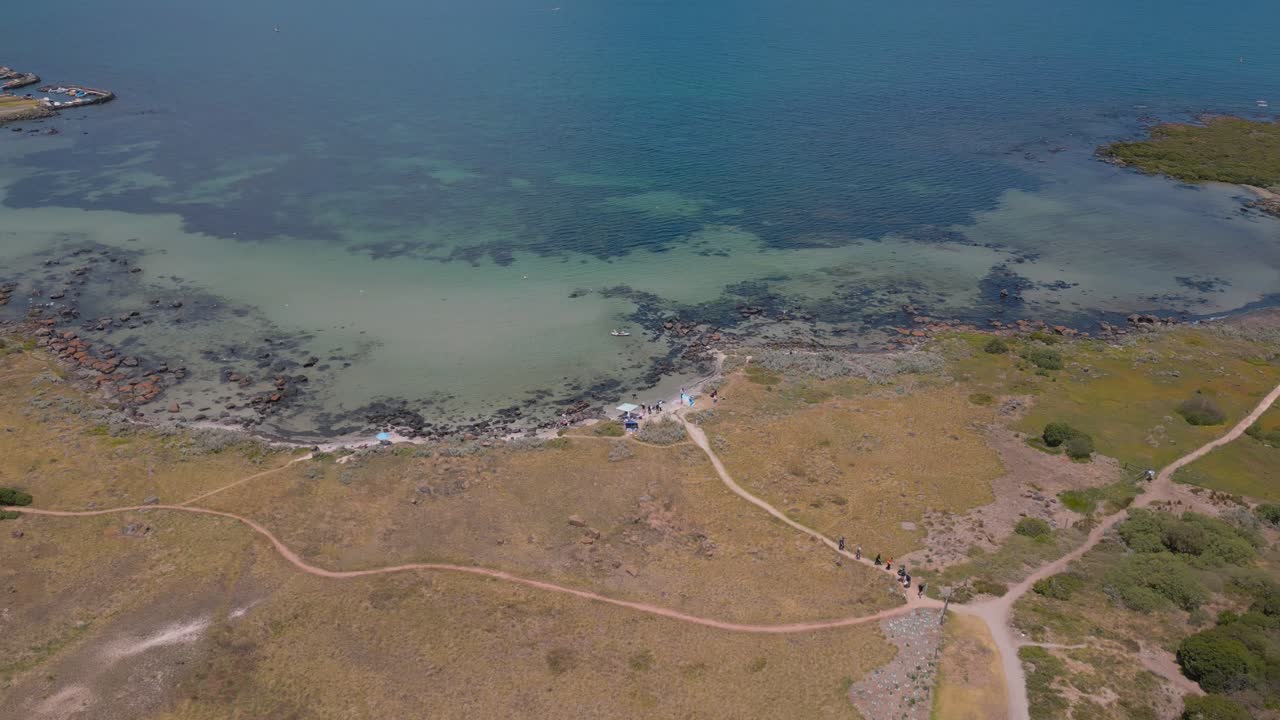 Aerial footage of the Jawbone Marine Sanctuary in Williamstown, Melbourne, panning upwards to reveal the vast Ocean.