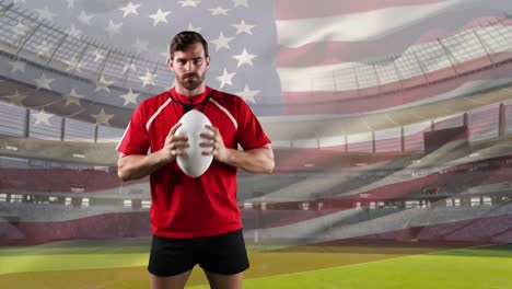 professional rugby player standing in front of a flag and stadium