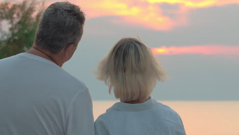 Senior-couple-turning-to-the-camera-and-smiling