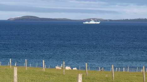 a royal navy coastguard fisheries protection vessel sails on the broadbay inlet