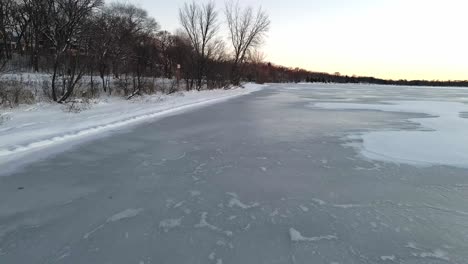 lake shore completly frozen ice layer