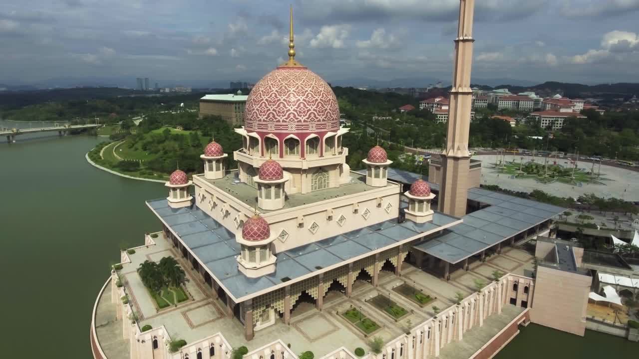 Drone circling around the beautiful Putra Mosque in Putrajaya, Malaysia